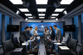 Corporate PR and communications team in a modern media briefing room