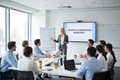 Professional trainer leading an engaged group of business employees in a modern training room